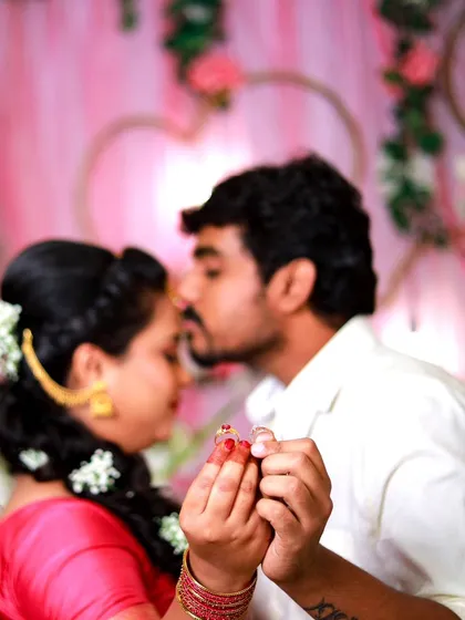 A close-up shot focusing on the couple's hands and engagement rings. This is a classic and meaningful photo that symbolizes their commitment.