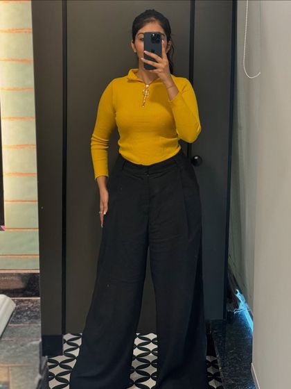 A pop of color with this mustard yellow knit top and black trousers. I believe in adding personality to your workwear with bright, confident colors.