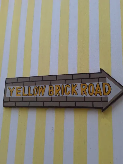 The famous "Yellow Brick Road" sign, pointing the way to a delightful meal.