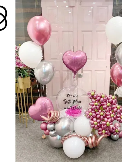 A blooming beautiful arrangement for the best mom in the world. This display combines a sculpted balloon flower bouquet with floating heart balloons and a personalized message, all in a lovely pink and silver color scheme.