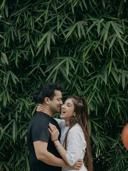 A candid laugh during a basketball-themed shoot. Capturing these spontaneous moments of joy is what makes a pre-wedding session truly personal.