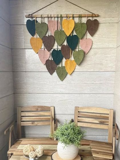 We love how our macrame leaf hanging shines in this beautiful balcony setup by one of our clients. The earthy tones of the leaves complement the wooden furniture perfectly.
