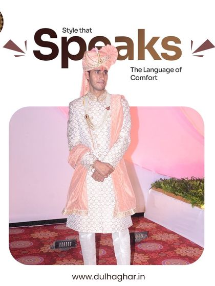 A groom in a peach and white sherwani, showcasing a softer color palette while maintaining a look of regal elegance.