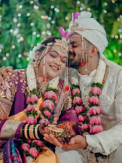 This intimate wedding moment captures the pure joy and connection between a couple. The groom's gentle kiss on the bride's forehead is a timeless expression of love that we specialize in preserving.