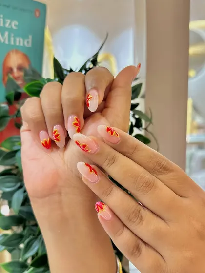 These nails are on fire! A cool, hand-painted flame design for a look that's edgy and hot.