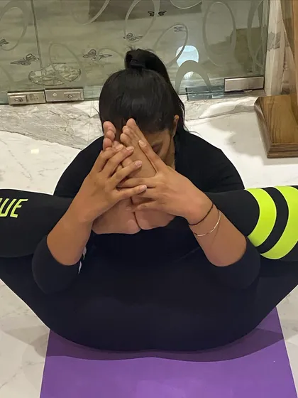 This is my playful way of saying Namaste. This pose, a variation of Kurmasana or Tortoise Pose, requires a lot of flexibility in the hips and spine.