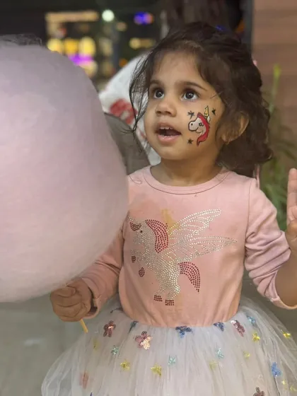 Nothing beats the simple joy of candy floss. This little unicorn, with her face painted and tutu on, is having the best time. I make sure there are always fun treats for everyone.