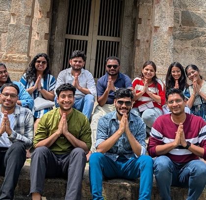 A moment of peace and respect at one of Mysore's ancient temples. The cultural immersion is a key part of the experience.