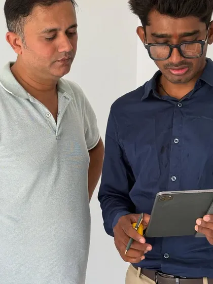 A close-up shot of me showing the client the proposed designs on a tablet. Digital plans make it easy to visualize the project.