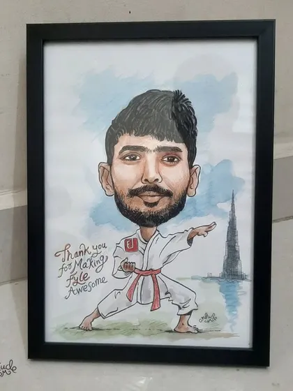 The final framed piece of a karate-themed caricature, a creative way to recognize an employee's passions.