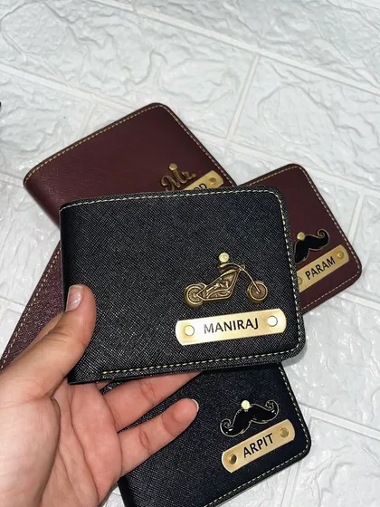 My custom men's wallets are one of my most popular gifts. This black wallet was personalized for Maniraj with his name and a cool motorcycle charm. You can choose from different colors, charms, and name styles to create a truly unique accessory.