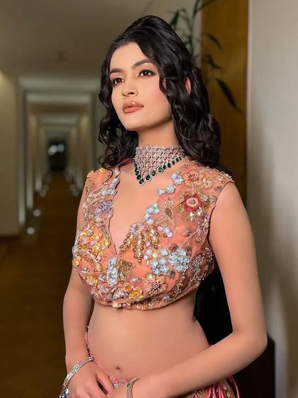 A different take on the Rang look, with a beautifully embroidered peach blouse.