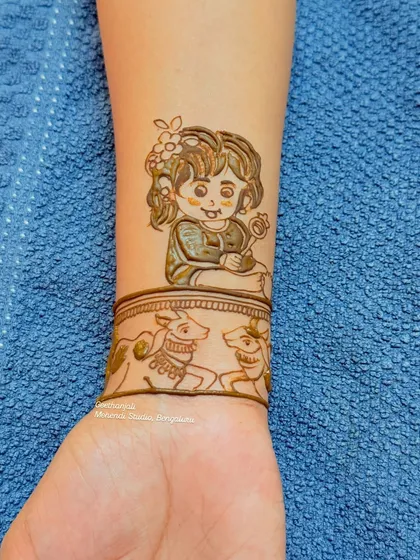 A close-up of the adorable child portrait from the baby shower mehendi, showcasing the fine detail and shading.
