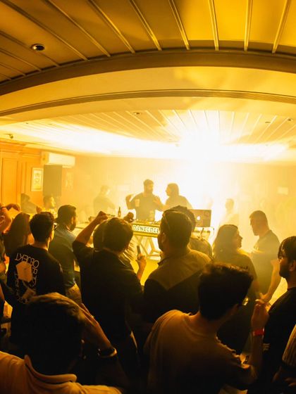 A shot from a packed daytime event. The golden light and happy faces say it all. These gigs are all about good vibes and bouncy music.