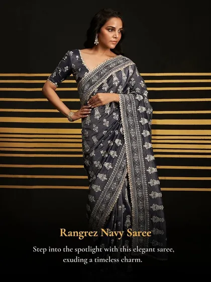 Step into the spotlight with the Rangrez Navy Saree. This elegant saree exudes a timeless charm, perfect for a formal wedding event.
