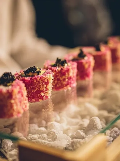 Our approach to Pan-Asian cuisine is modern and artful. This is our signature pink sushi, presented on a bed of dry ice for a dramatic effect. We love creating dishes that are as beautiful to look at as they are to eat.