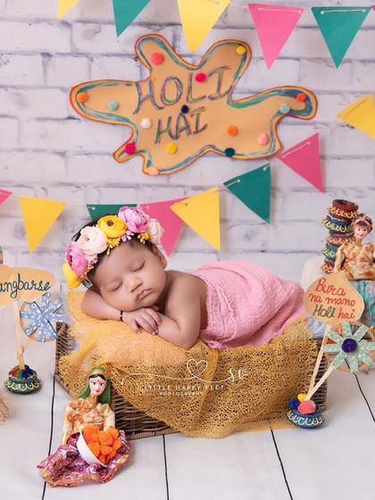 Capturing the joy of Holi with this colorful and playful setup. Even while sleeping, this little one is ready for the festival of colors. These themed shoots are a wonderful way to mark your baby's first holidays.
