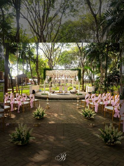 The view down the aisle towards the mandap. We used simple floral bunches to line the walkway, guiding the eye towards the main ceremony space without overwhelming the natural setting.