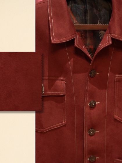 This image highlights the rich texture of a crimson suede shacket. The swatch detail allows you to appreciate the material's quality and color depth up close.