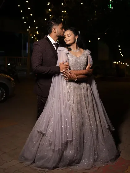 An intimate embrace under the stars. This couple's engagement photo is full of romance, with the bride's sparkling lavender gown catching the light.