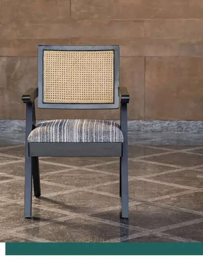 The Chandigarh Chair, shown here in our Terra project, is a versatile piece that complements any space. Its design, crafted from sustainably sourced oak, is a nod to timeless aesthetics and our commitment to responsible furniture making.