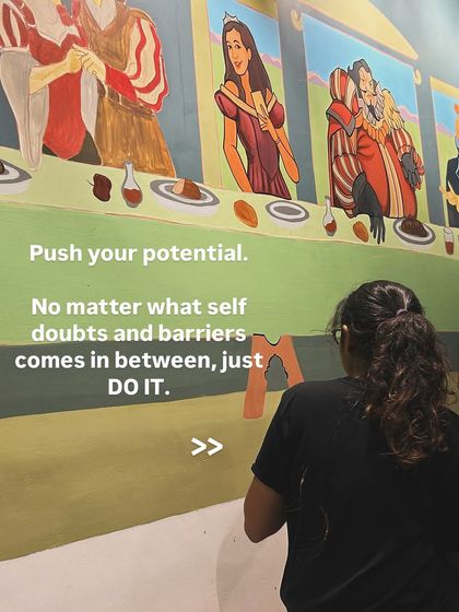 You have to push your potential, no matter what self-doubts come in between. This photo shows me working on a complex character mural, a reminder to just do it and push through creative barriers.