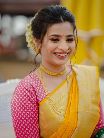 A joyful, candid shot. Her natural smile is the best accessory, enhanced by a minimal makeup look that lets her personality shine.