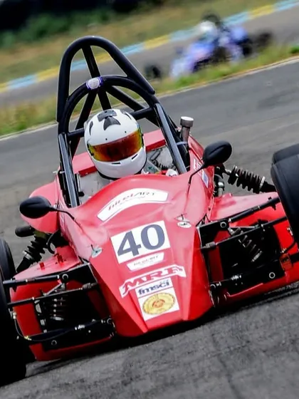 A dynamic shot of the number 40 Formula LGB car cornering hard, demonstrating the vehicle's capabilities.