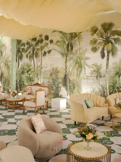 A lounge that feels like a tropical escape. We used a massive, hand-painted tropical mural as a backdrop, paired with modern, comfortable seating and a unique patterned floor to transport guests to paradise.