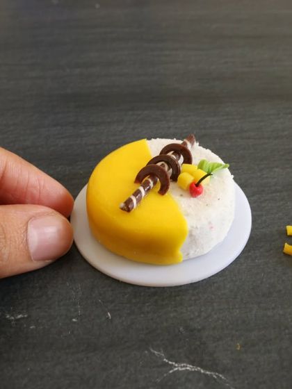 Another angle of my miniature mango cake, showing the smooth glaze.