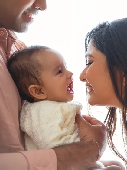 The sound of a baby's laughter is pure music. Capturing this moment of shared joy between a mother and her baby is what makes my work so rewarding.