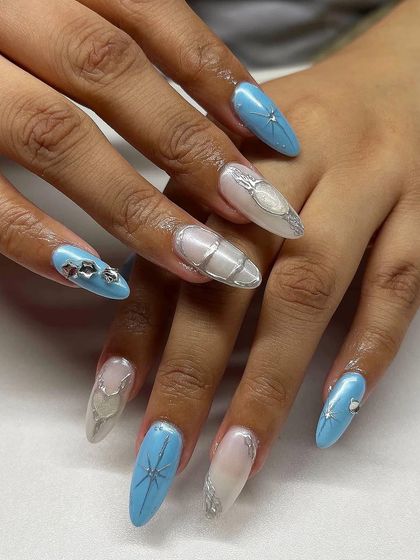 An icy and beautiful design. This set features a mix of light blue, silver chrome, 3D textures, and star-shaped rhinestone accents.