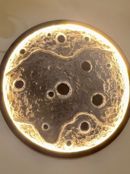 The 24-inch lamp glowing brightly. This large statement piece can transform any room.