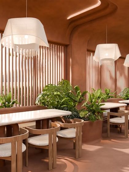 The restaurant design is a palette of warmth and calm. The earthy walls, lush plants, and crafted details come together in a quiet rhythm.