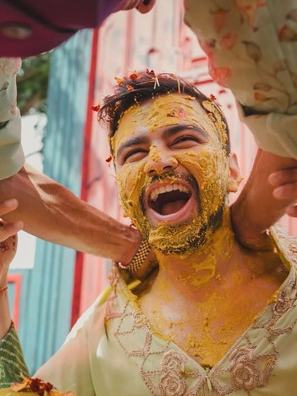 The groom did not stand a chance. The moment the haldi started, it turned into an all-out color riot with friends and family joining in the fun.