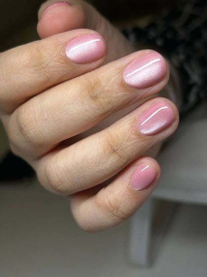 A soft, baby pink cat-eye manicure. The subtle magnetic shimmer adds a delicate, magical glow to this sweet and feminine color.