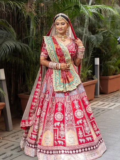 A little blush and fluffy lashes. This crimson red bridal look is all about embracing color while celebrating elegance.