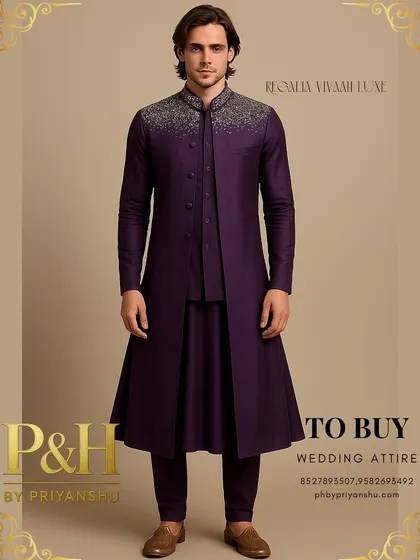 I designed this layered ensemble for the modern groom who seeks a blend of tradition and contemporary flair. It features a deep purple Anarkali-style kurta under a structured half-jacket and a long, flowing top jacket, crowned with brilliant silver hand-embroidery on the collar and shoulders.