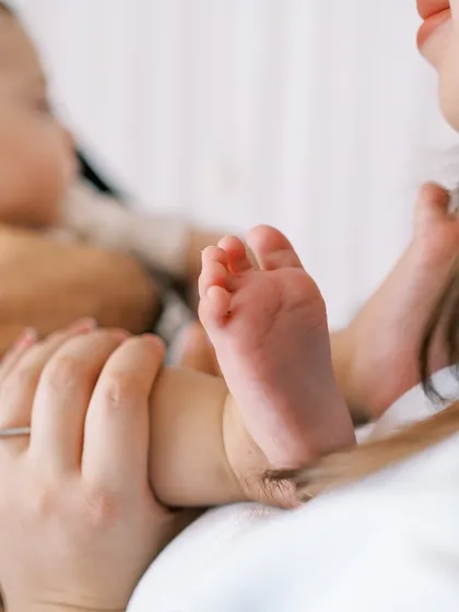 A close-up on the baby's tiny feet. Even at seven months, they are still so small and perfect.