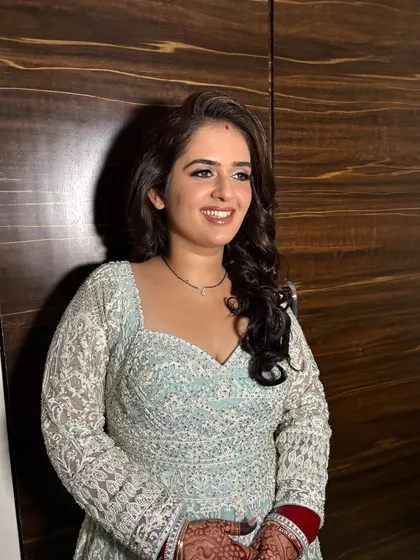 Another angle of this sangeet look, showing the flawless makeup and happy smile.