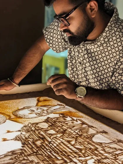 A moment of concentration while creating the Ram Mandir sand art. My studio is my sacred space.