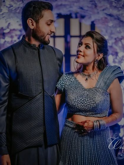 A glamorous couple portrait from a Sangeet night in Goa. The dramatic lighting and their stylish outfits create a chic and modern vibe.