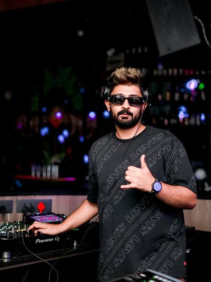 A relaxed pose at the console, ready for the night.