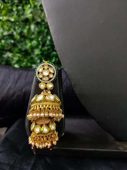 The matching double jhumka from this set, a statement piece on its own.
