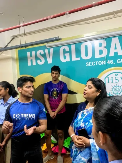 Explaining the principles of leverage and technique during a self-defense workshop. Knowledge is the first step towards empowerment and safety.