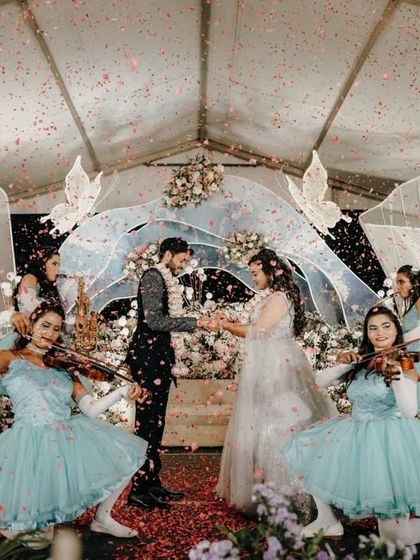 A magical moment with confetti raining down on the couple during their fairytale-themed ring ceremony.