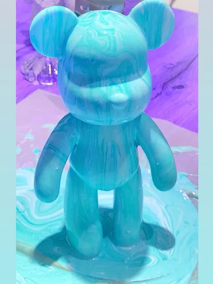 Meet a one-of-a-kind fluid art bear. In this workshop, you just pour, swirl, and watch the colors create their own unique patterns. It's messy, fun, and totally unpredictable.