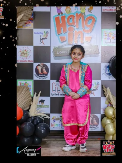 One of our Bhangra stars in her traditional pink and blue Punjabi suit, ready for her performance.