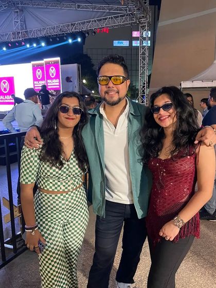 Posing with some of the band members and friends after a great week of shows. This photo shows the fun, celebratory side of our gig life.