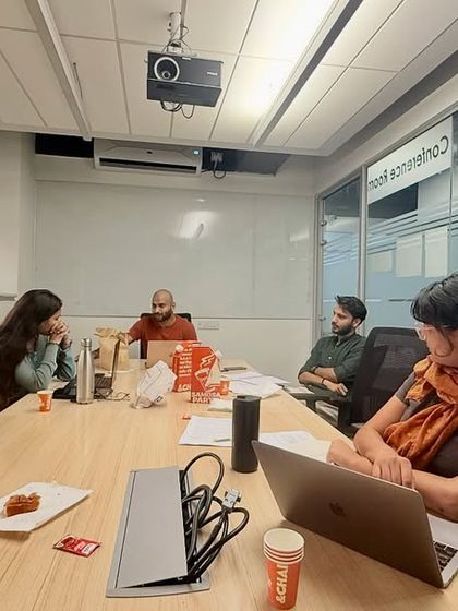 Another view of the Sugargliders in session, listening intently. The natural light in the room matches the bright energy of the group.